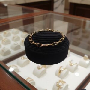 Gold paperclip chain bracelet.